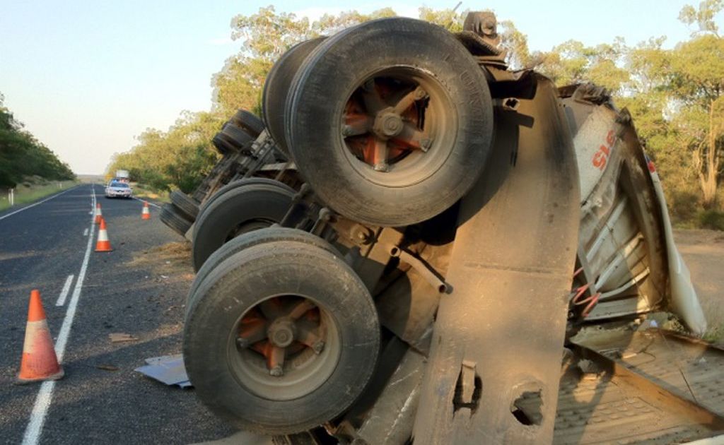 The driver of this truck escaped unhurt when the vehicle rolled on the Cunningham Highway near Warwick.